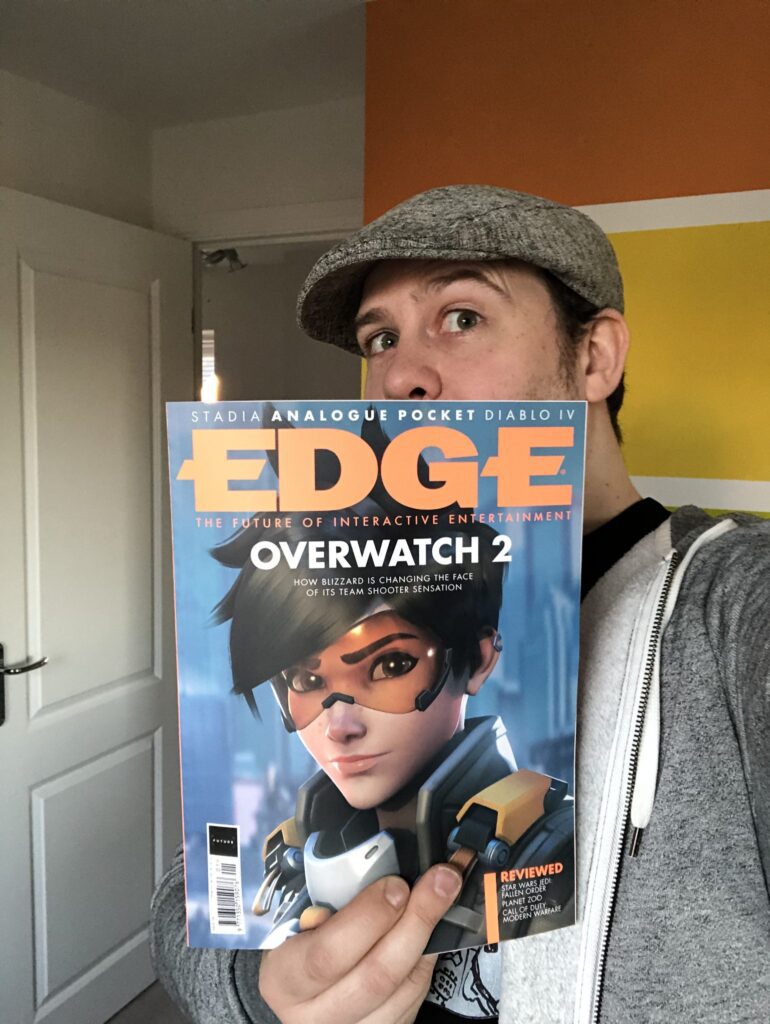 Photo of Phil (Technical Director) holding Edge Magazine