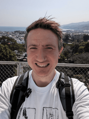 Oli Clarke Smith in front of a view over Japan