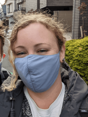 Rachel Clarke Smith wearking a facemask in a street in Japan